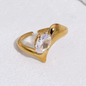 Detailed close-up of 18k gold plated wave ring with an oval sparkling zirconia stone