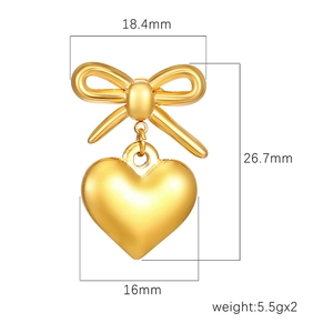 Golden bow heart drop earrings in 18K plated stainless steel with dimension markings