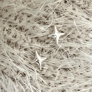 Elegant 925 sterling silver four-point star stud earrings with a polished finish