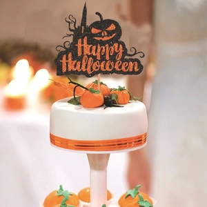 Glittery Happy Halloween cake topper with orange pumpkin silhouette on white cake