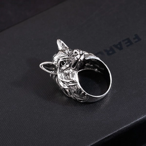 Macro detail of retro wolf head ring with vintage silver finish and antique carvings
