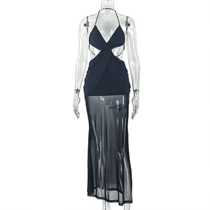 Detail of black halter maxi dress showing sheer mesh paneling and side cut-outs