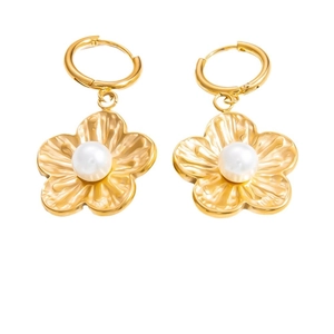 Elegant gold flower pearl earrings featuring detailed petal texture and white pearl center