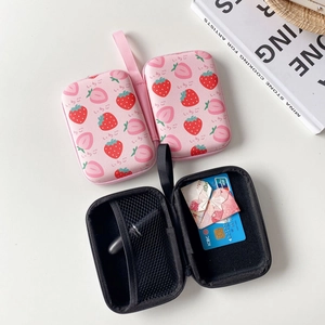 Detail view of portable strawberry zip pouch with internal mesh pocket for headphones