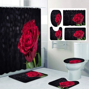 Detail of 4-piece bathroom set featuring a large red rose print on a dark black background