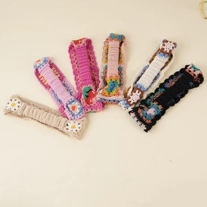 Set of six handmade crochet headbands with daisy, cherry, and retro geometric patterns
