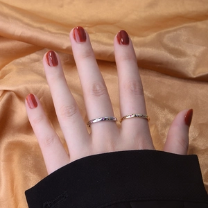 Detail of colorful cubic zirconia stones on minimalist gold and silver star rings