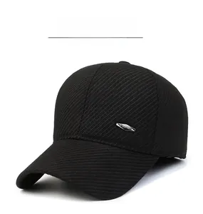 Detailed close-up of warm black baseball cap featuring twill texture and metal logo