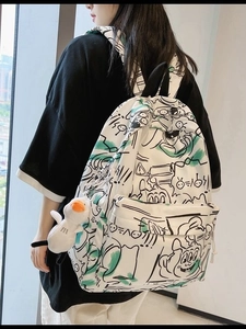 White waterproof graffiti backpack for students featuring cartoon prints and plush duck