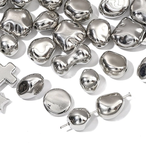 Polished silver CCB star and pebble beads for DIY jewelry making sets on white background