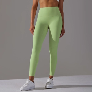 Détail du legging de yoga vert citron à taille haute avec effet gainant et sans couture