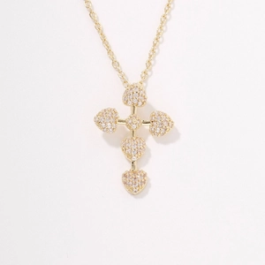 Minimalist gold heart-shaped cross pendant necklace with sparkling white rhinestones
