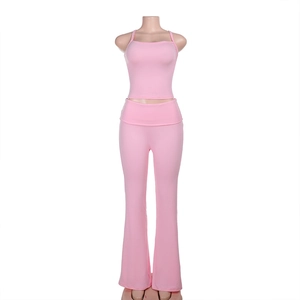 Detail view of pink slim fit two-piece set with cropped tank top and flare pants