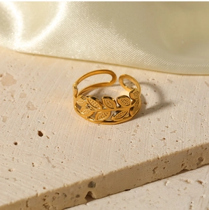 Macro shot of 18k gold plated stainless steel ring with leaf pattern and grain texture