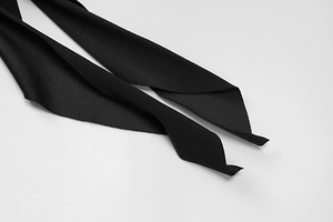 Detailed macro view of black high-density textured fabric belt with smooth edges