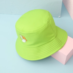 Detail of frog on mushroom embroidery on a vibrant neon green cotton bucket hat