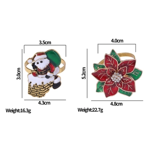 Christmas napkin rings with Santa Claus and red flower designs, metal enamel with rhinestones
