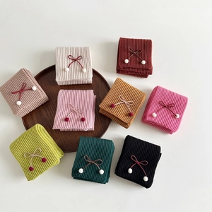 Chic knitted bow scarves for kids in multiple colors including cream and burgundy