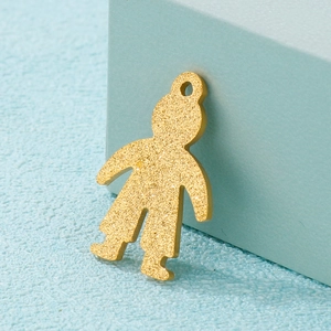 Frosted gold boy-shaped stainless steel pendant with glitter texture on blue background