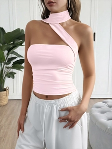 Detailed view of pink one-shoulder halter neck top with stylish ruched fabric details