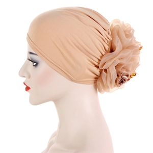 Elegant beige Muslim headscarf with a large 3D floral design and amber bead accents