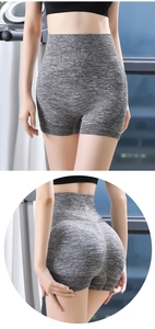 Detail of high-waist grey seamless fitness shorts featuring push-up butt lift texture