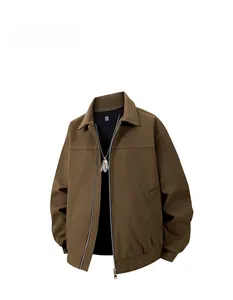 Detail of a brown vintage lapel jacket featuring a metal zipper and ribbed cuffs