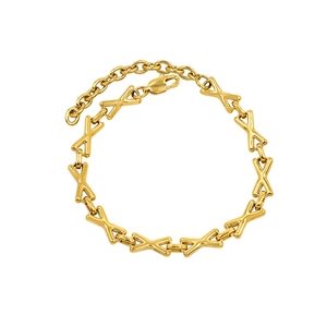 Detailed close-up of golden X-shaped links and lobster clasp on a stainless steel bracelet