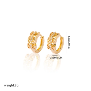 Detail view of 1.3cm gold-plated hollow geometric earrings with white zircon accents