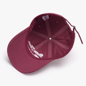 Inside view of burgundy baseball cap with Bear Town embroidery and adjustable strap