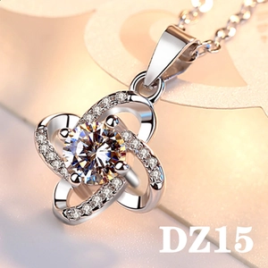 Detailed macro view of silver flower pendant with 2ct round cut cubic zirconia
