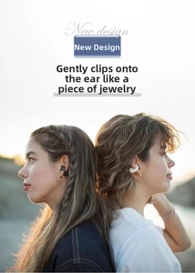 Close-up of black and white clip-on bone conduction earbuds worn by models outdoors