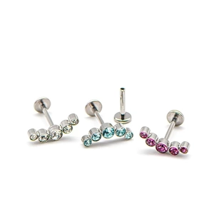 Surgical steel curved bar with five sparkling zircons in clear blue and purple colors
