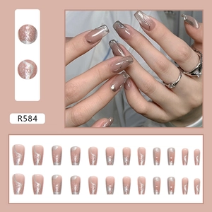 Detail of nude pink cat-eye press-on nails with silver shimmer and wavy texture