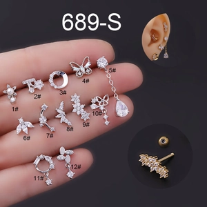 Detail set of 12 silver 16G stainless steel cartilage earrings with zircons and pearls