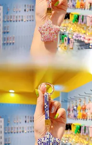 Detail of star-shaped keychains with sparkling rhinestones in pink and blue colors