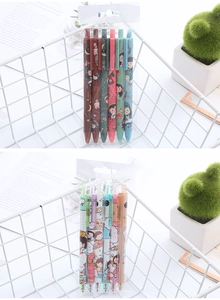 Close-up of colorful retractable gel pens with cute patterns in a desk storage basket