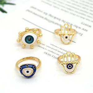 Adjustable Evil Eye and Hamsa Hand gold ring set with blue enamel and zircons