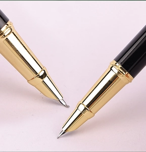 Macro detail of golden metal nib and black barrel of the Morandi business fountain pen
