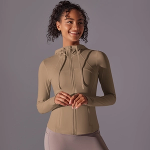 Detail of slim-fit hooded yoga jacket with zipper and breathable side stitching