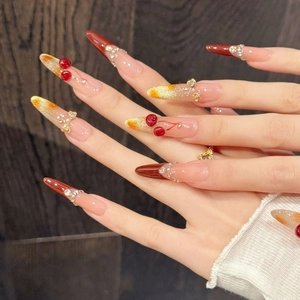 Handmade cherry wine red press-on nails with 3D fruit charms and sparkling rhinestones
