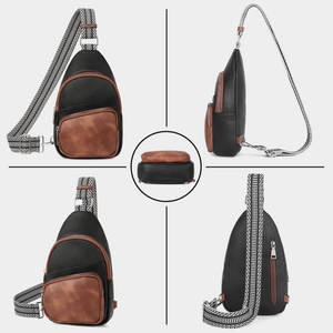Detail view of small black and brown PU leather sling bag with patterned wide strap