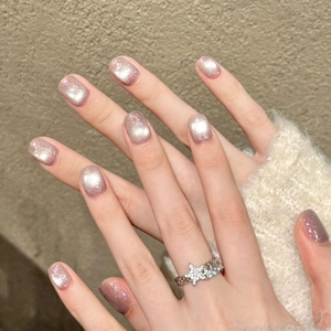 Pink purple cat-eye press-on nails with silver star ring and shimmering glitter finish