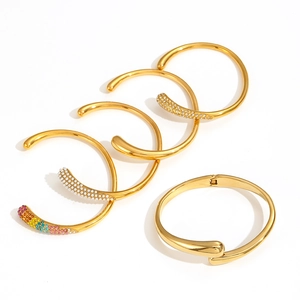 Polished 18k gold plated stainless steel bangles set with crystals on white background