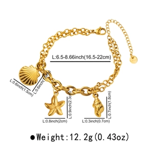 Detailed view of gold stainless steel bracelet with seashell, starfish and conch charms