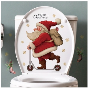 Detail of Santa Claus on scooter toilet lid sticker with Merry Christmas greeting text