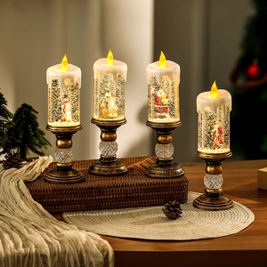 Detailed view of LED Christmas snow globe candles with Santa and snowman figurines