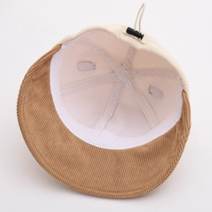 Detail view of corduroy bucket hat interior with adjustable toggle and drawstring