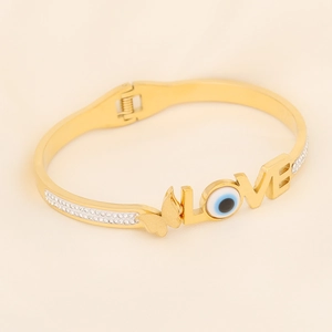 Gold Evil Eye LOVE bangle with butterfly and sparkling pavé crystals for women