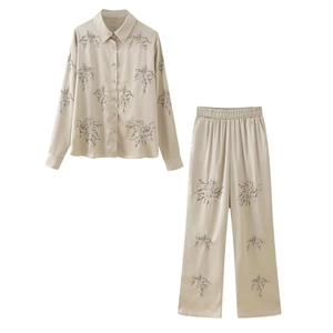 Champagne satin two-piece shirt and wide-leg pants set with silver floral embroidery